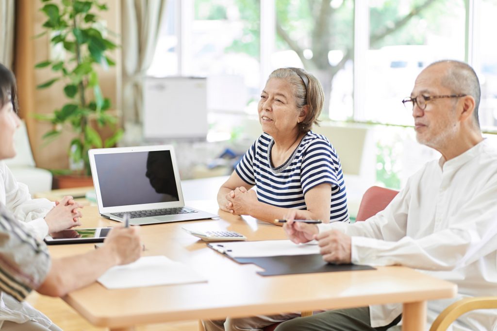 An elderly couple consulting on a life plan
